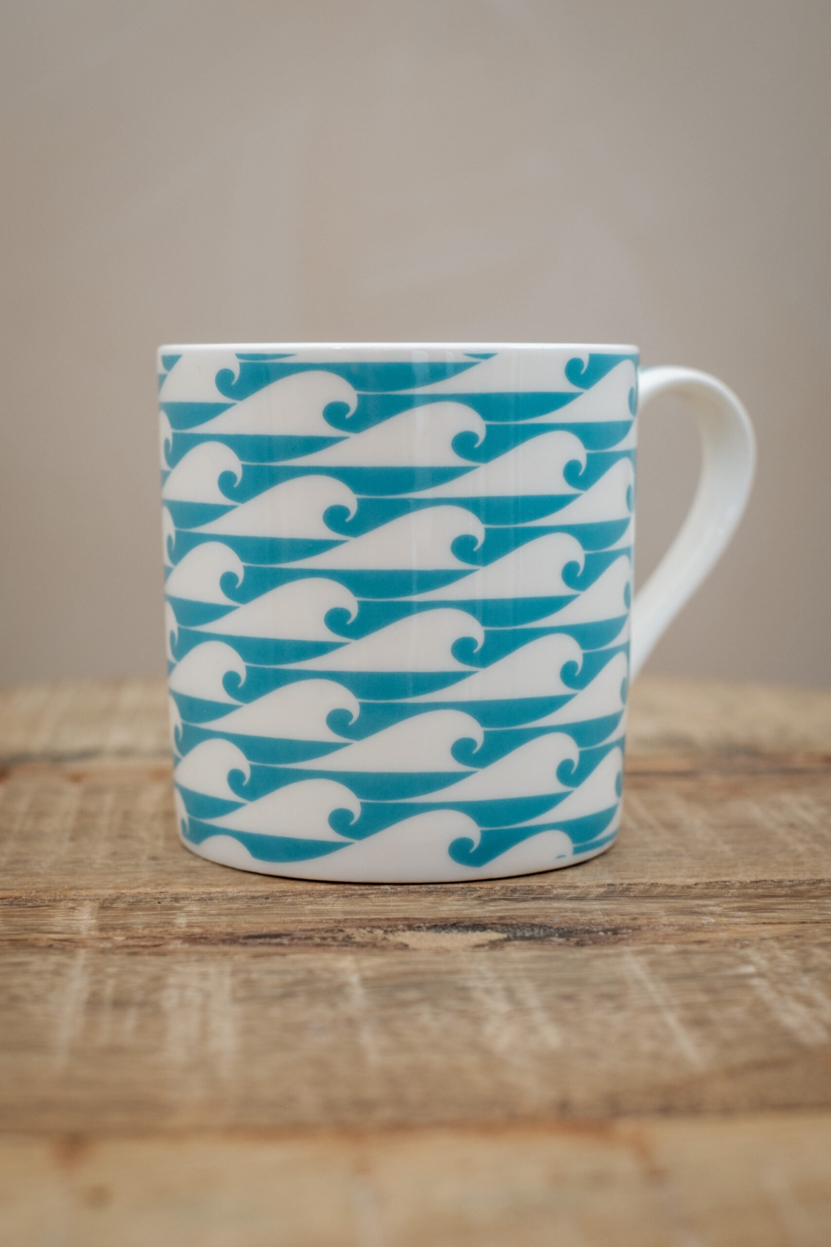 The Cornish Surfer bone china mug with Ocean Jade wave design, designed in Cornwall