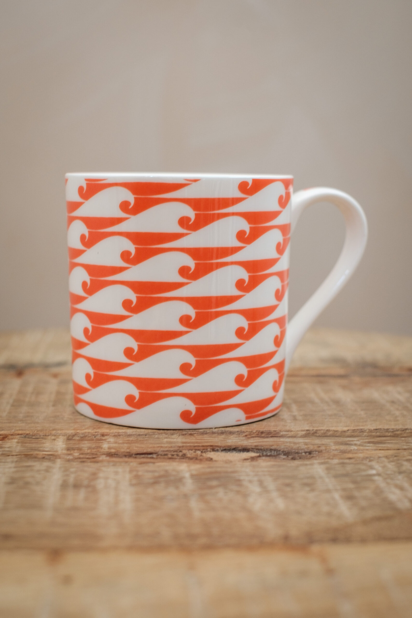 The Cornish Surfer bone china mug with coral wave design, designed in Cornwall