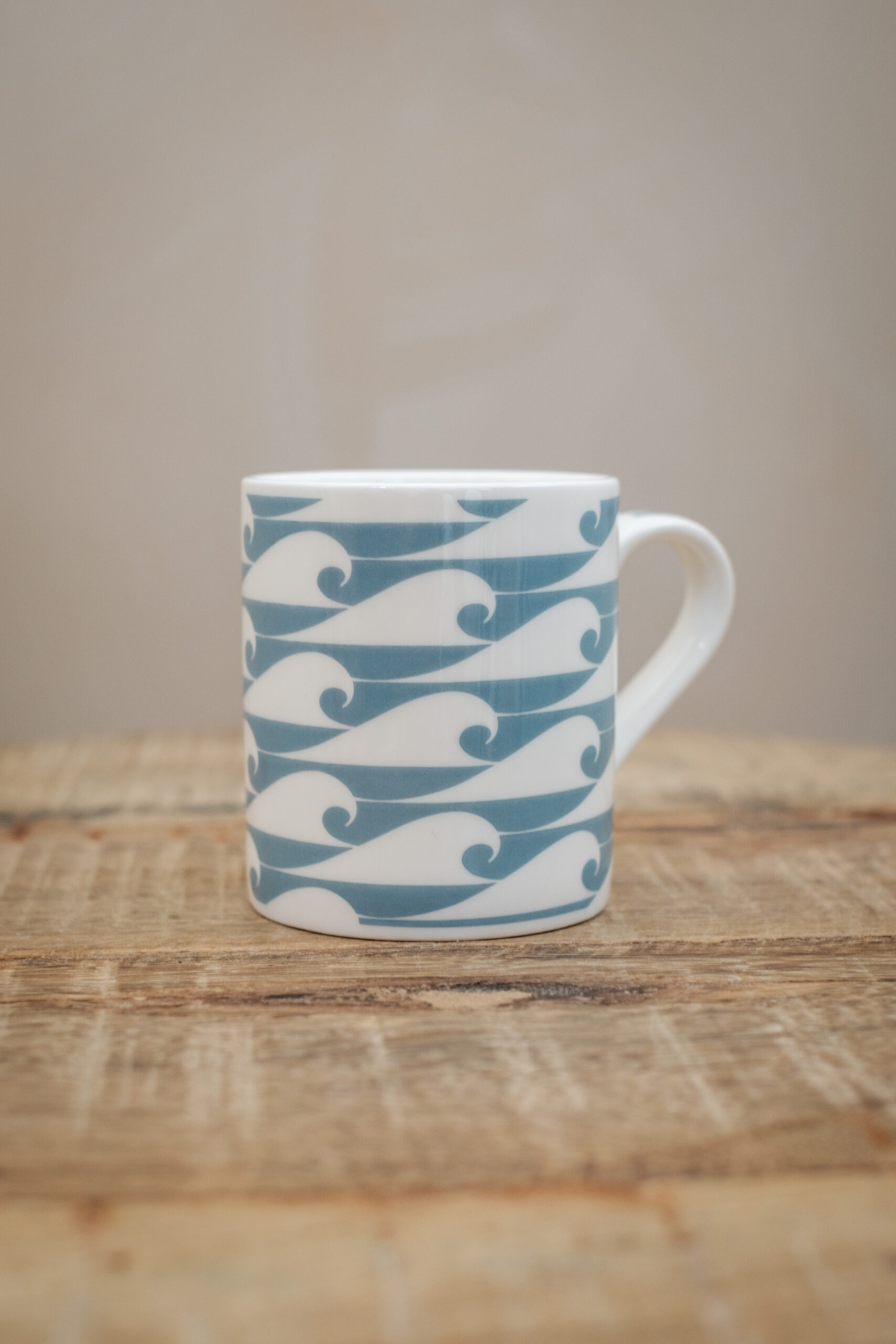 The Cornish Surfer espresso cup “The Shorty” with Duck Egg Blue wave design, made in Cornwall.