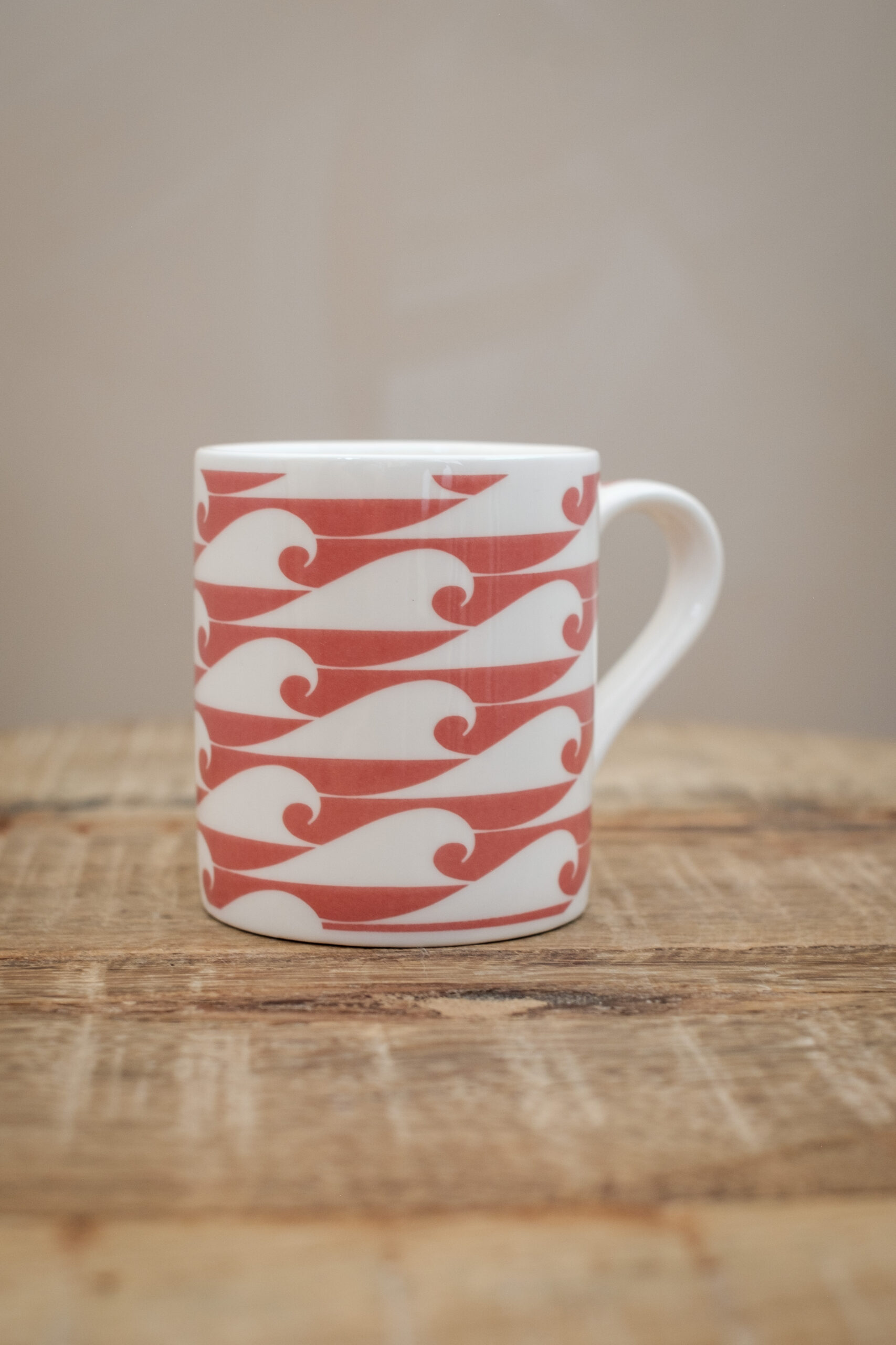 The Cornish Surfer espresso cup “The Shorty” with campervan Wild Salmon Pink design, made in Cornwall.