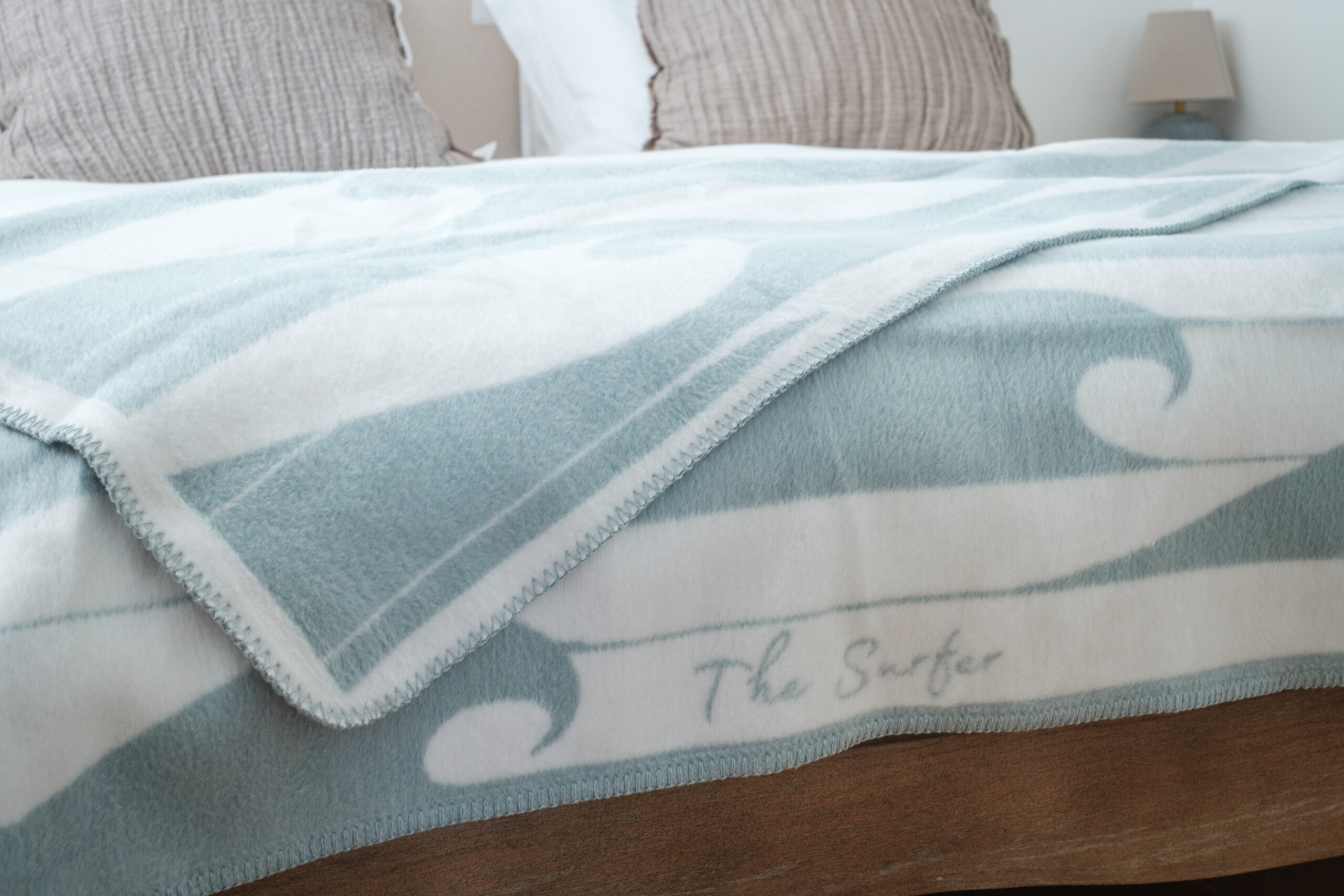 The Cornish Surfer offers duck egg blue throw. Designed in Cornwall.