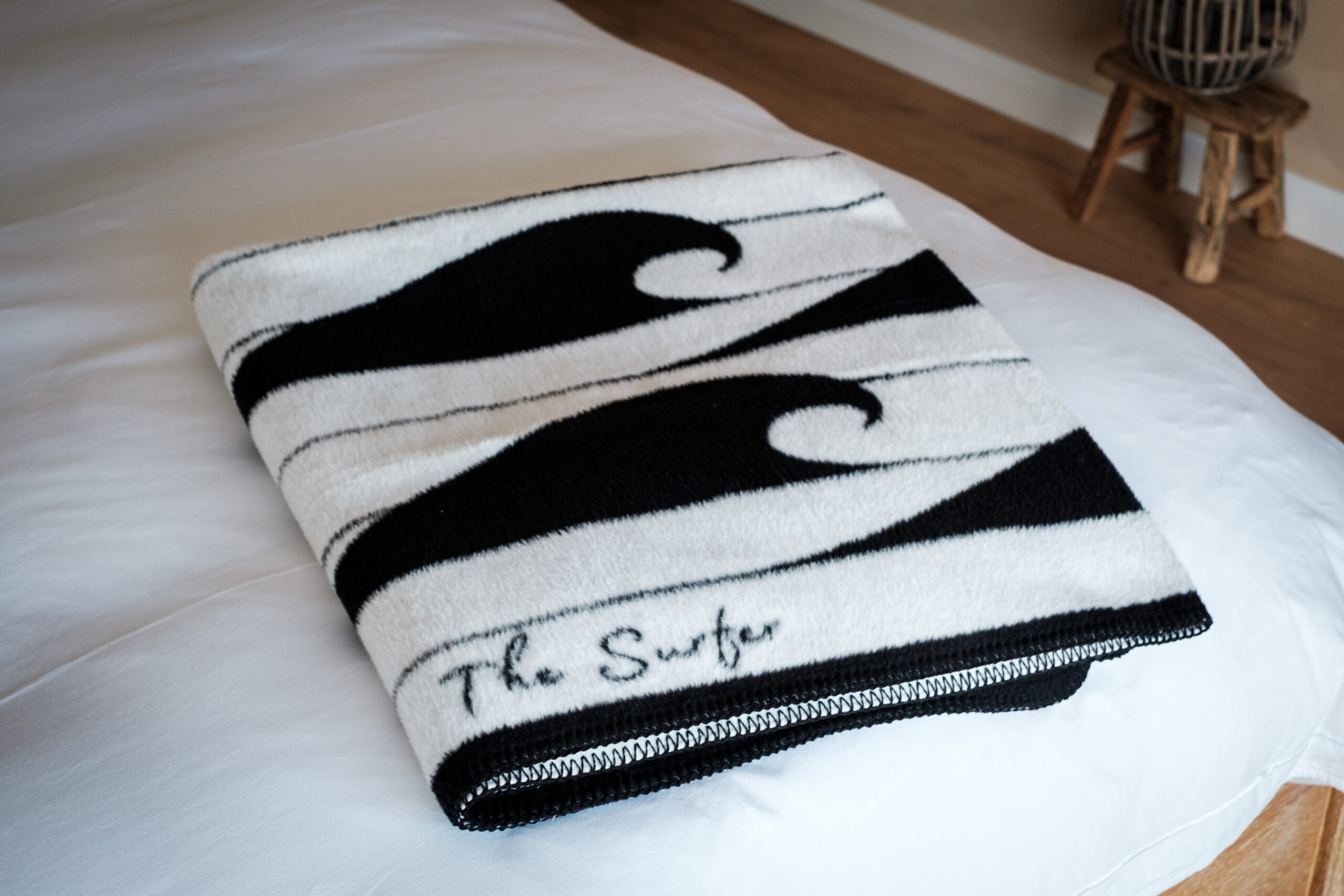 The Fluff Throw in Black – Modern Coastal Recycled Blanket with Wave Design