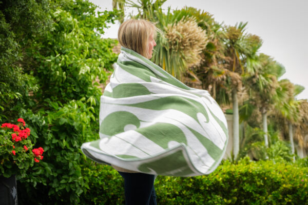 Recycled cotton throw used outdoors in botanical setting