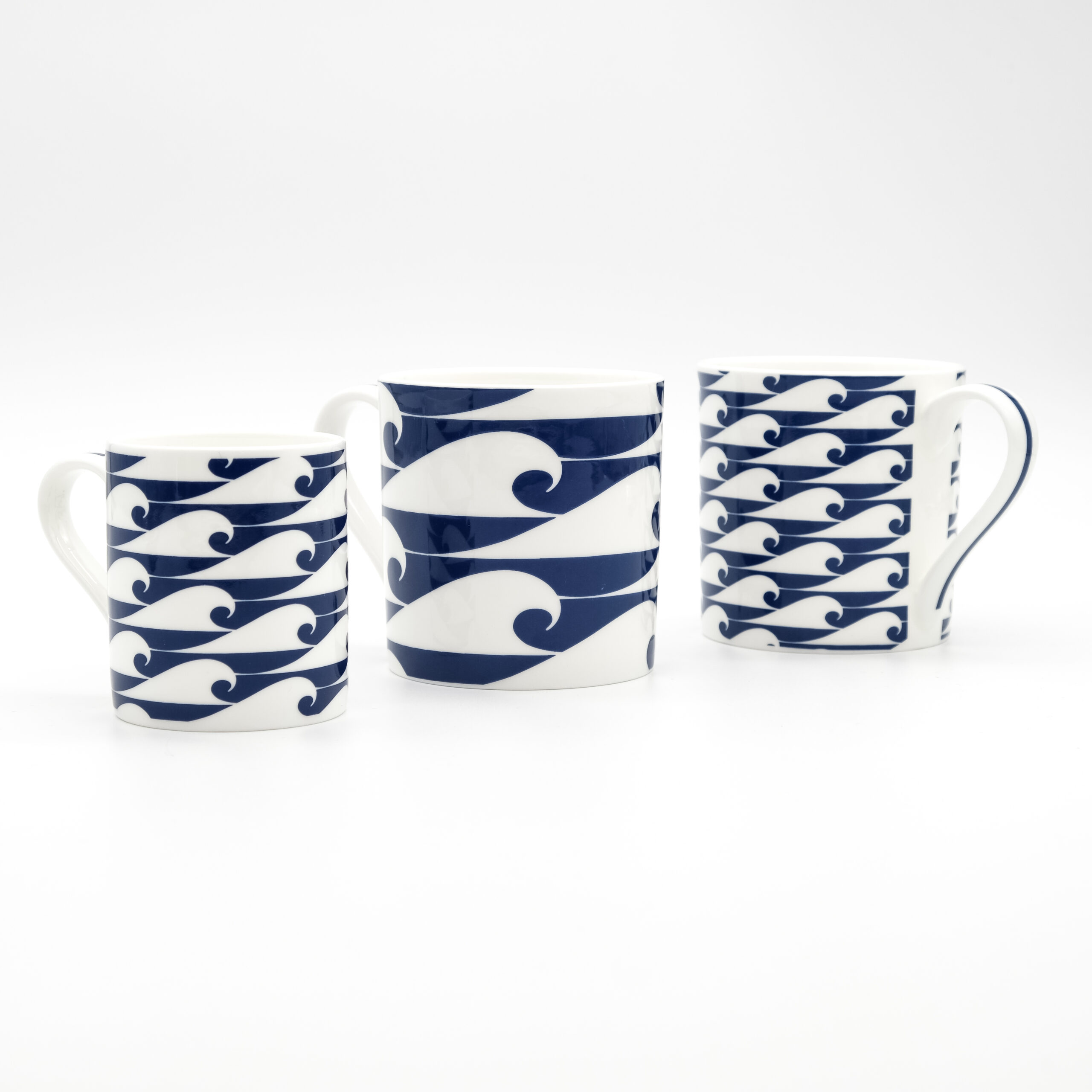 Nautical Blue mugs with hand-painted wave designs, evoking the ocean and coastal lifestyle